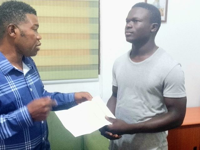 NLA Presents Plane Ticket to Orphan Harris N.K. Mulbah for Studies in China